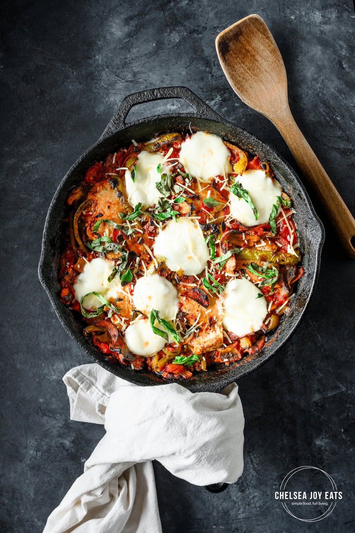 Overhead view of finished gluten free high protein skillet pizza chicken, topped with mozzarella