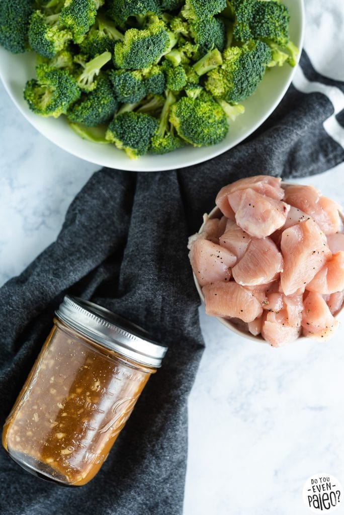 Quick & Easy Chicken & Broccoli Stir Fry Recipe ingredients with a dark napkin on a marble background by DoYouEvenPaleo.net