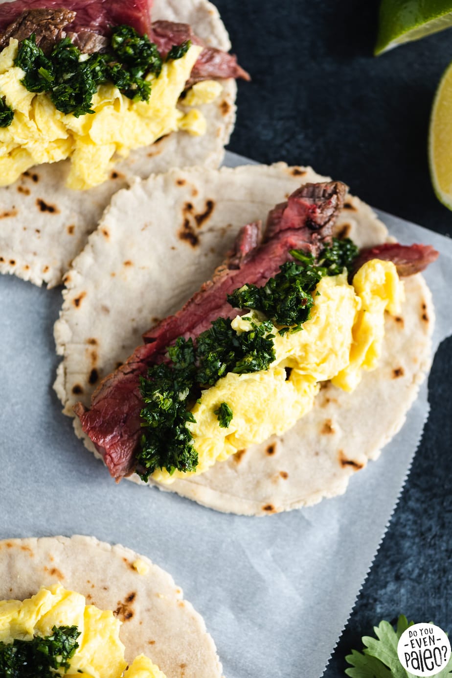 Paleo Steak and Egg Breakfast Tacos with Chimichurri on parchment paper