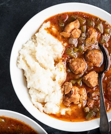 Bowl of slow cooker gumbo with rice and a spoon
