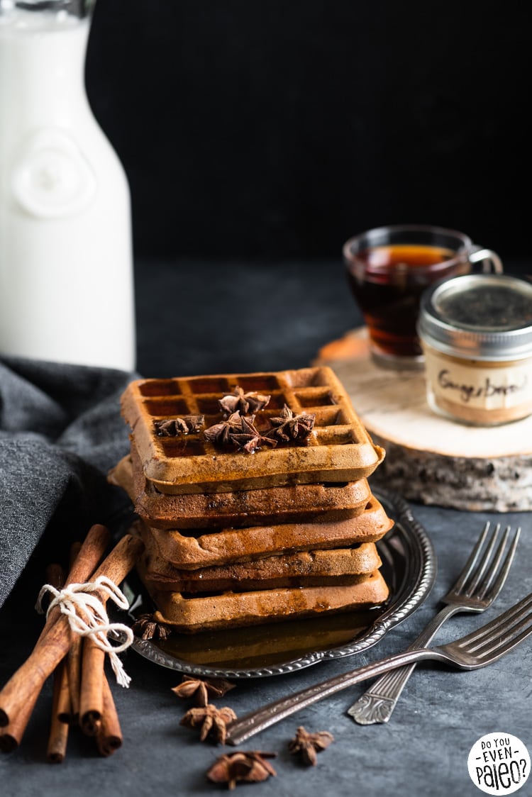 Waffles on a vintage plate garnished with star anise and sticks of cinnamon