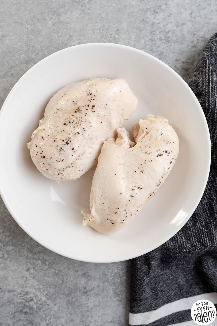 Two poached chicken breasts