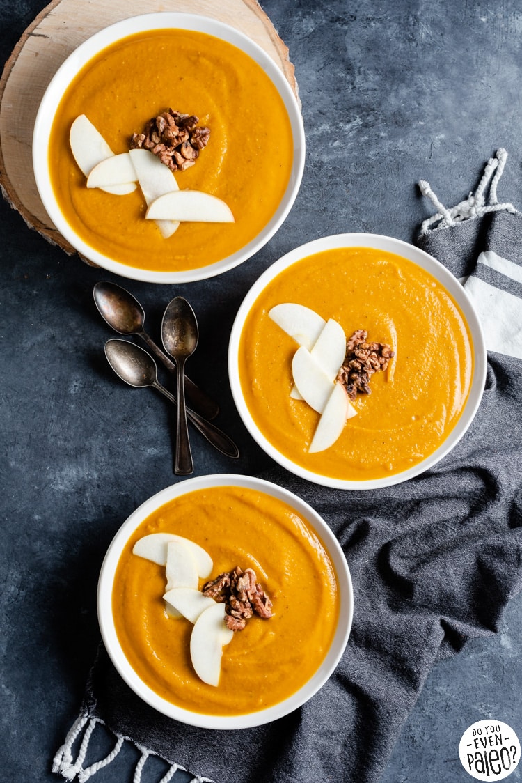 Three bowls of creamy squash soup