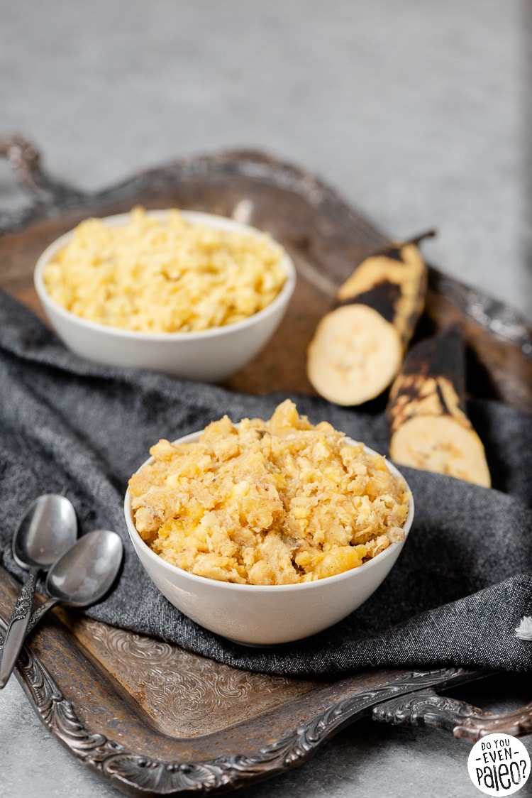 Bowl of mashed plantains, with another bowl in the background