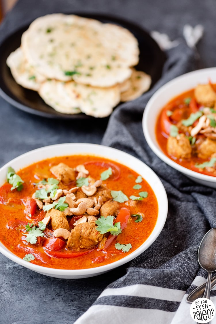 Bowls of gluten free chicken curry with gluten free flatbread