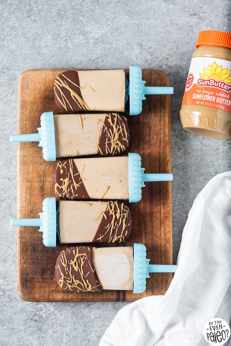 Row of 3-ingredient sugar free banana popsicles with peanut butter