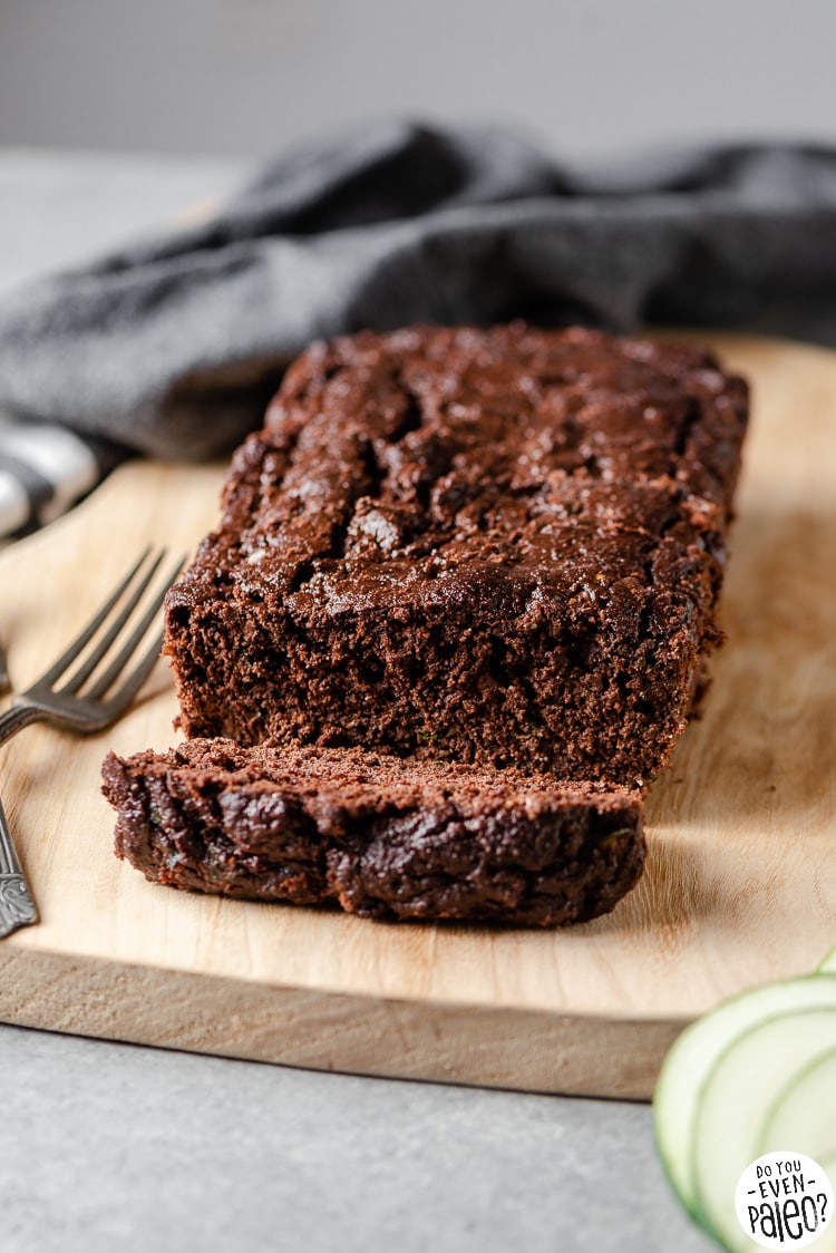 Gluten free chocolate zucchini bread on a wooden cutting board