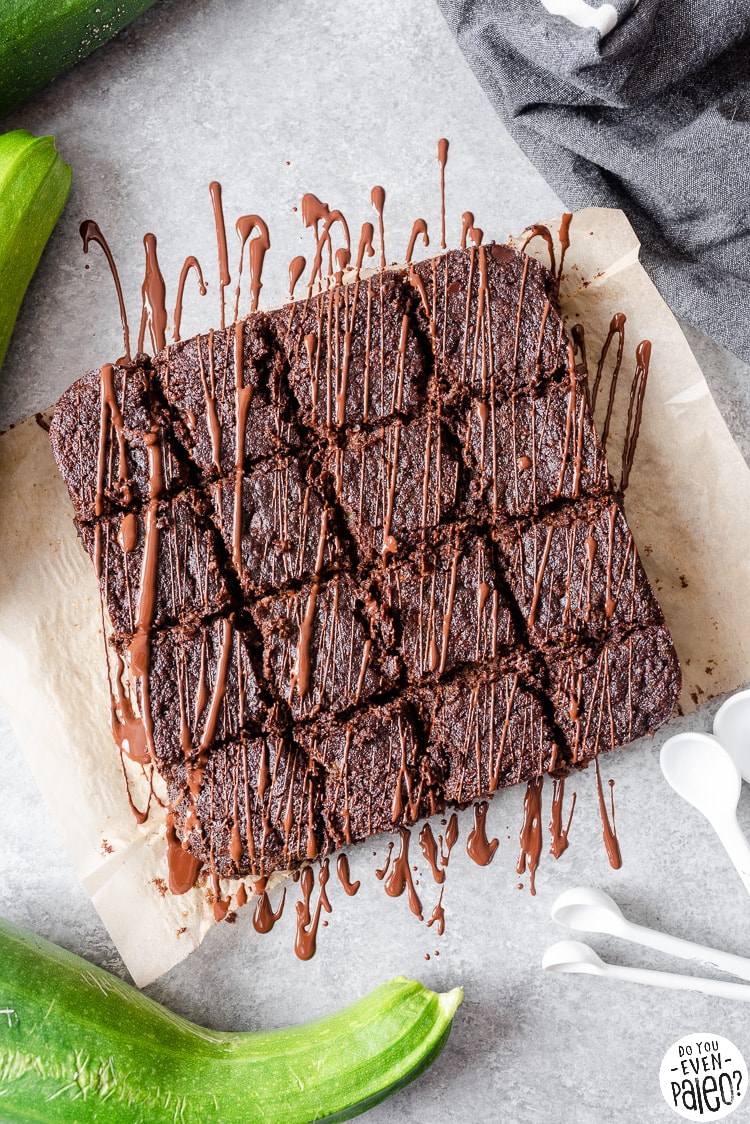 Overhead view of sliced gluten free brownies drizzled in chocolate