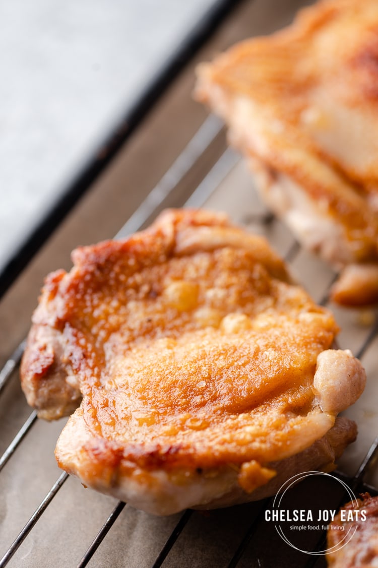Closeup of a crispy-skinned chicken thigh