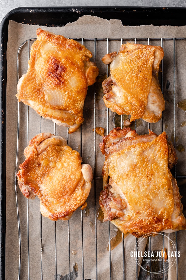 Crispy skillet chicken thighs on  a wire rack