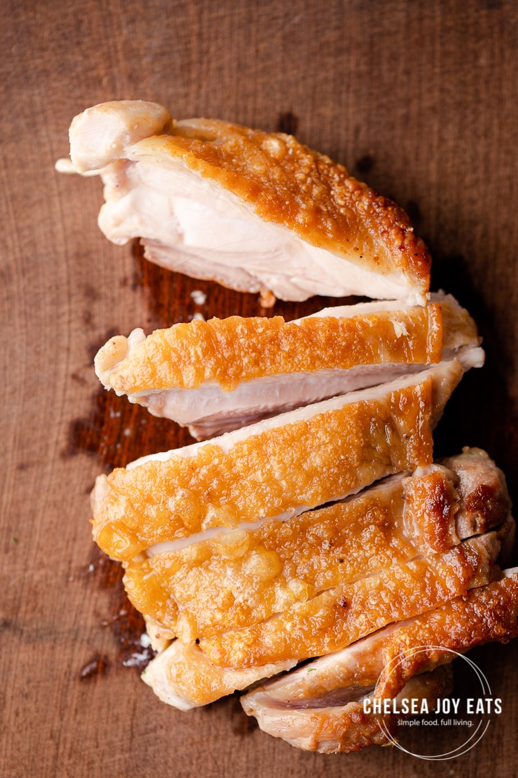 Closeup of a sliced pan-fried chicken thigh