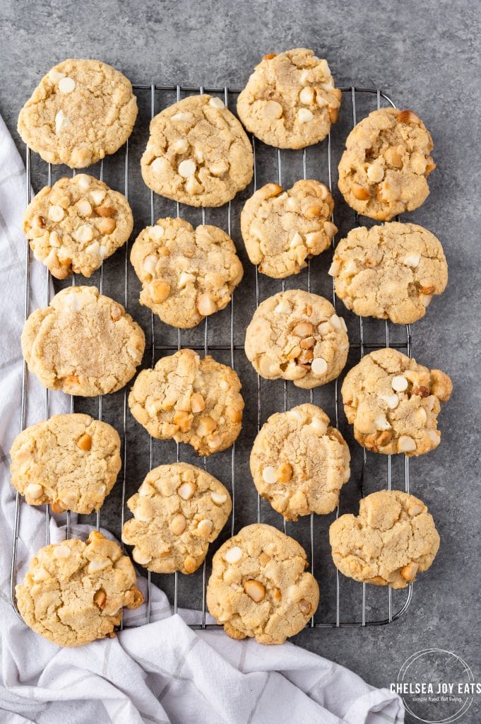 Tray full of cooling gluten free white chocolate macadamia nut cookies.