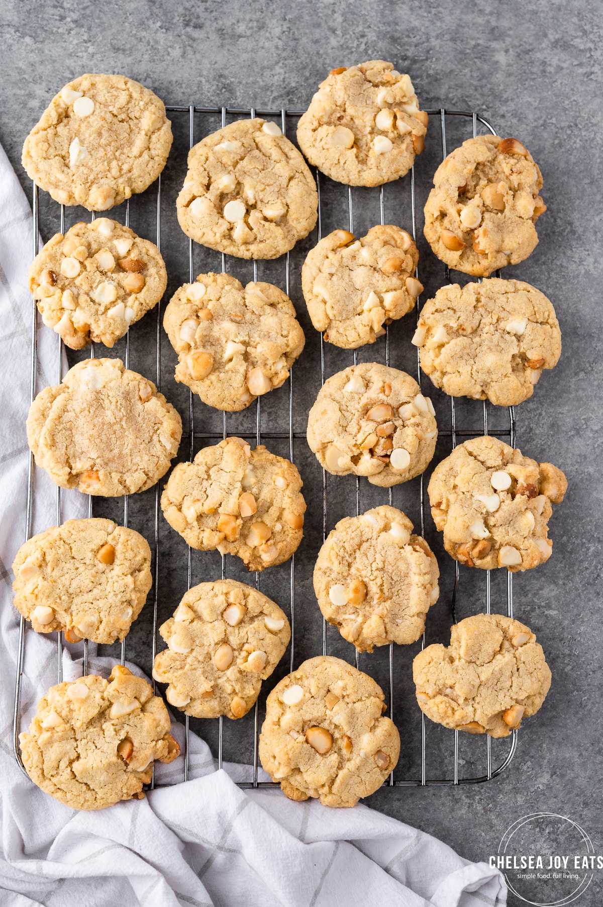 Tray full of cooling gluten free white chocolate macadamia nut cookies.