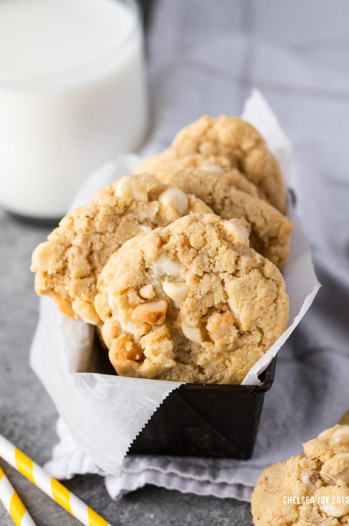 Gluten free white chocolate macadamia nut cookies arranged in a small loaf pan.