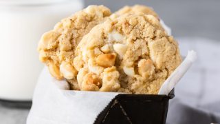 Gluten free white chocolate macadamia nut cookies arranged in a small loaf pan