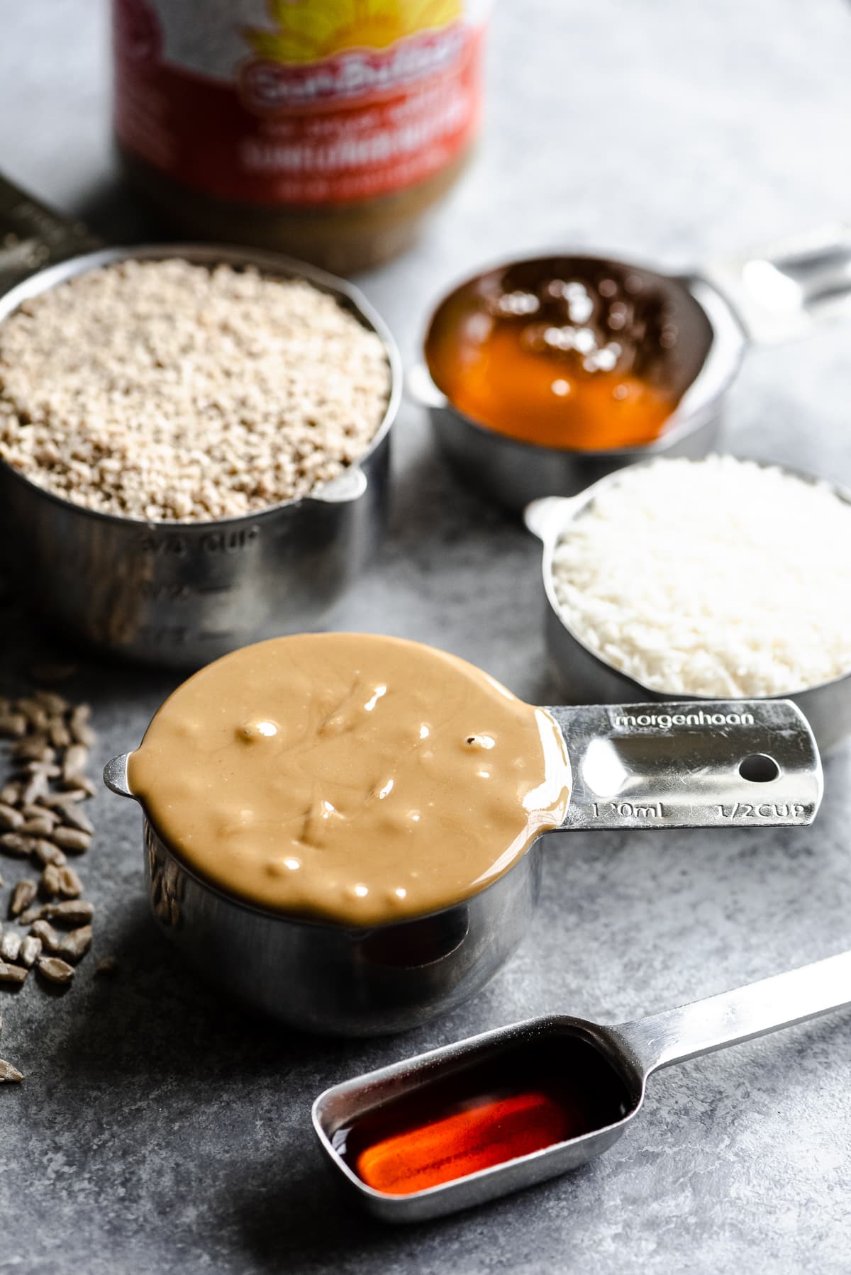 Ingredients for no bake SunButter energy bites in measuring cups