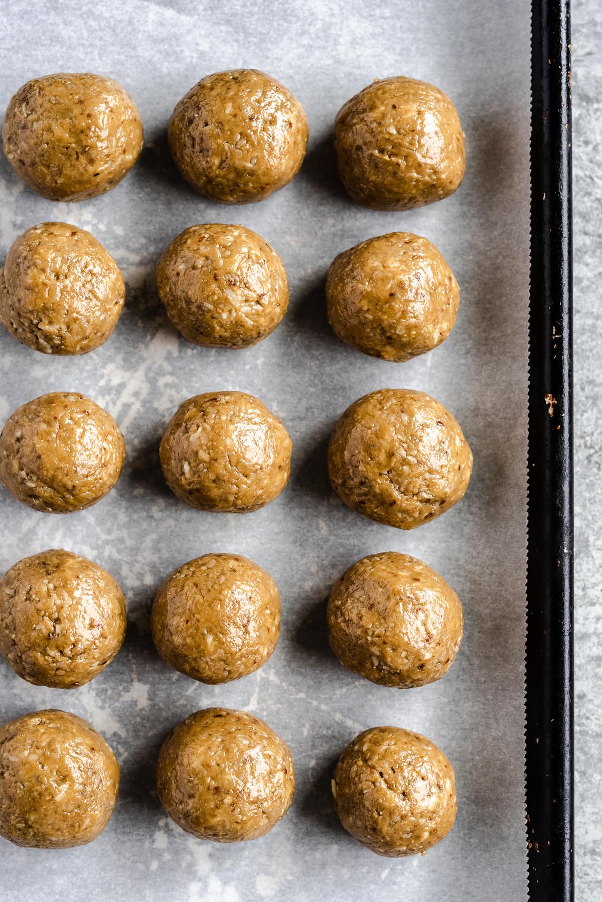 Closeup of nut free, no bake sunflower seed butter energy balls on a tray
