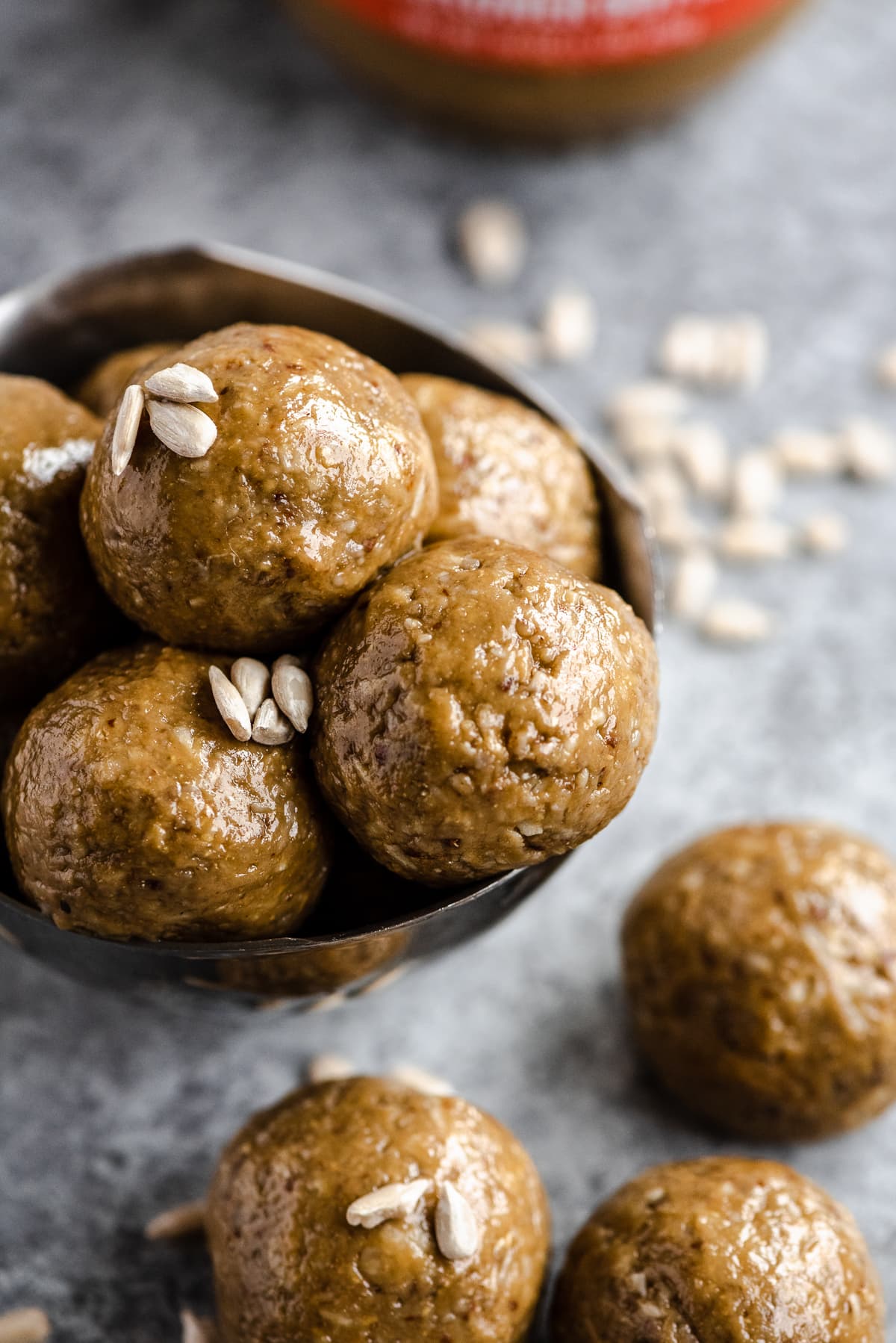 Grain free nut free energy balls stacked in a small bowl