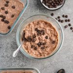 Overhead view of high protein chocolate overnight oatmeal with cottage cheese and protein powder