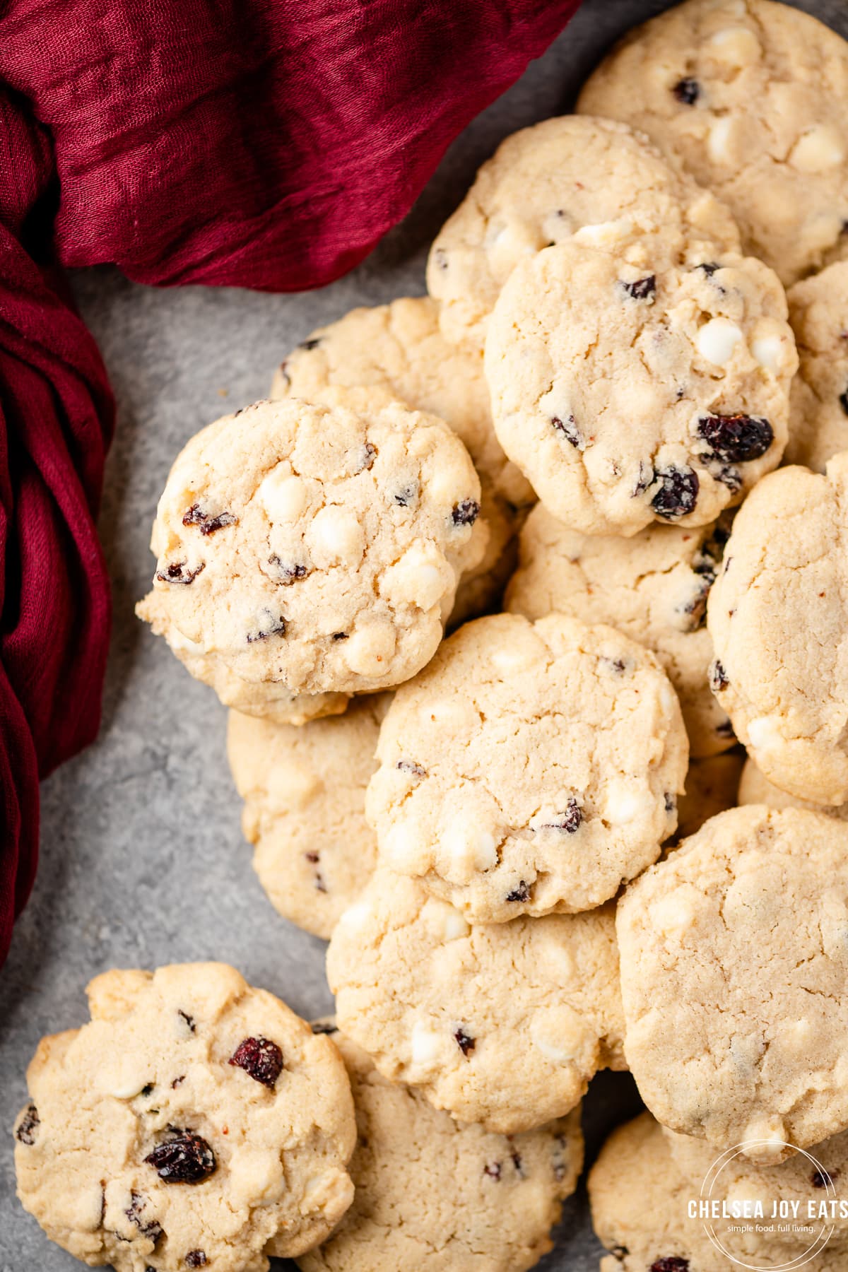 Gluten free white chocolate cranberry cookies arranged on a marble background