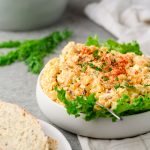 Cottage cheese egg salad served in a bowl over lettuce