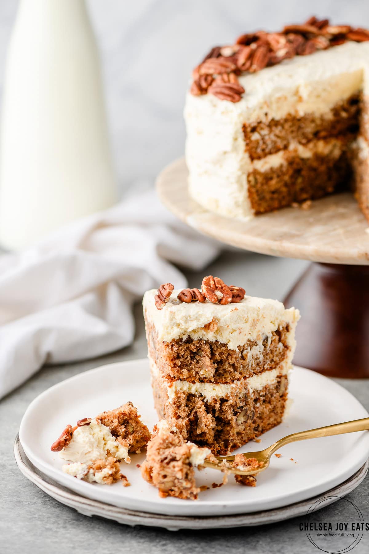 Slice of hummingbird cake with a bite taken out