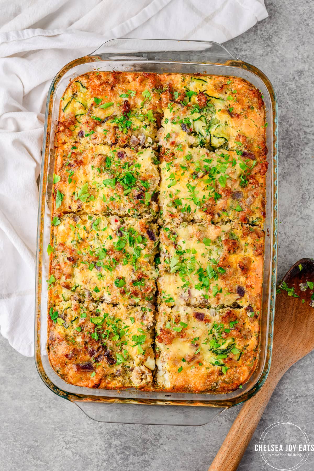 Zucchini Sausage breakfast casserole in a baking dish, sliced into 8 servings