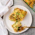 Zucchini sausage breakfast casserole served on a plate with a fork taking a piece