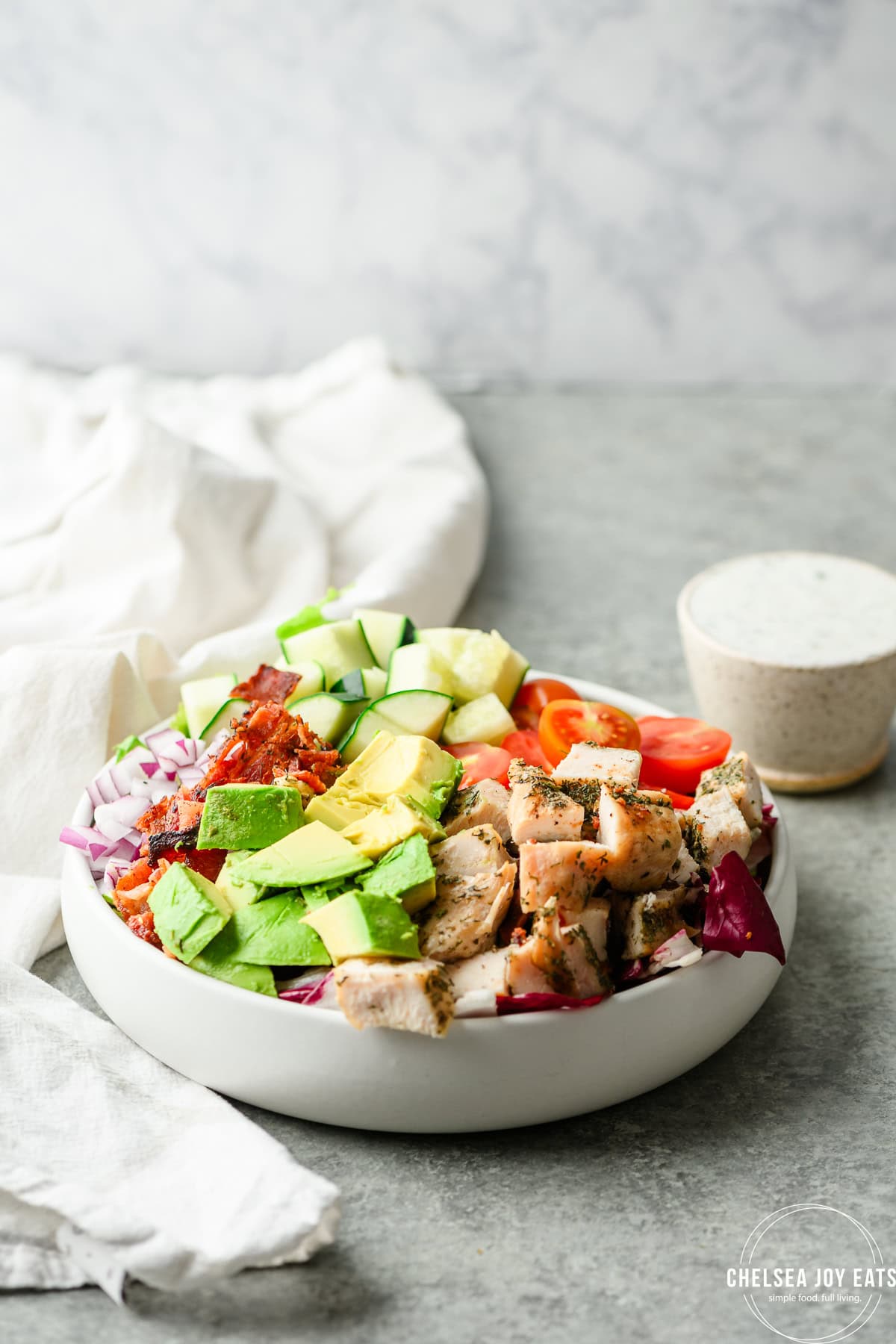 Chicken bacon ranch salad with homemade Greek yogurt ranch dressing on the side