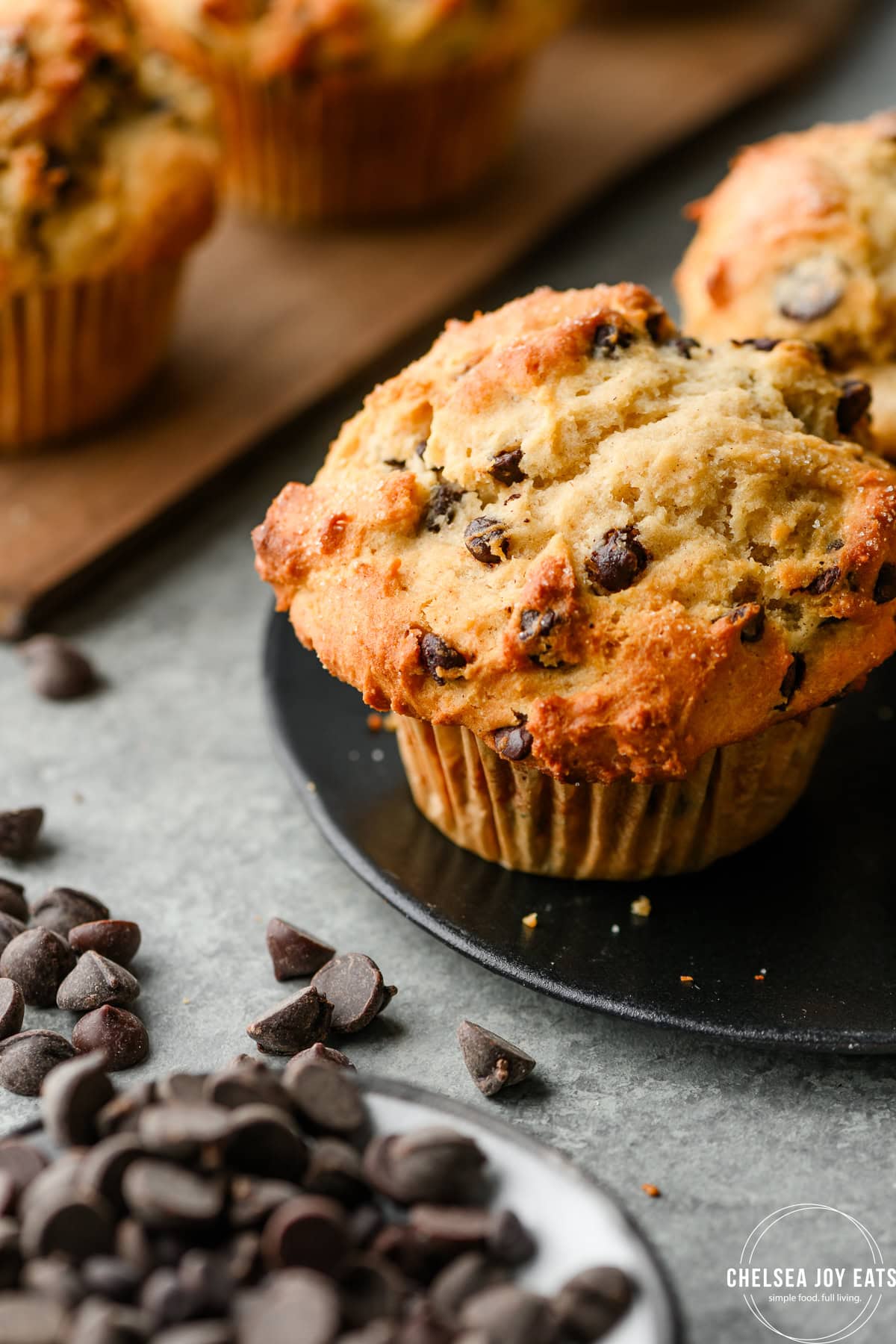 Closeup of a gluten free chocolate chip muffin with a beautifully-domed golden brown top