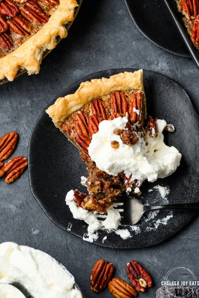 Closeup of a gluten free pecan pie slices with a messy bite taken out