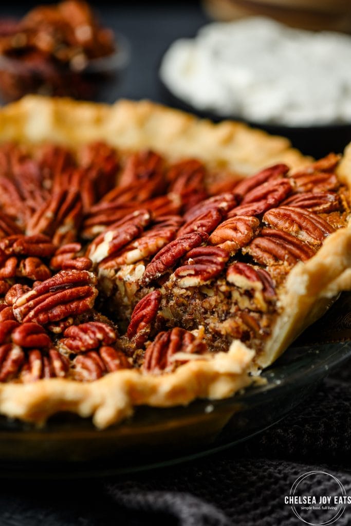 Closeup view of removing a slice of pecan pie from the pan