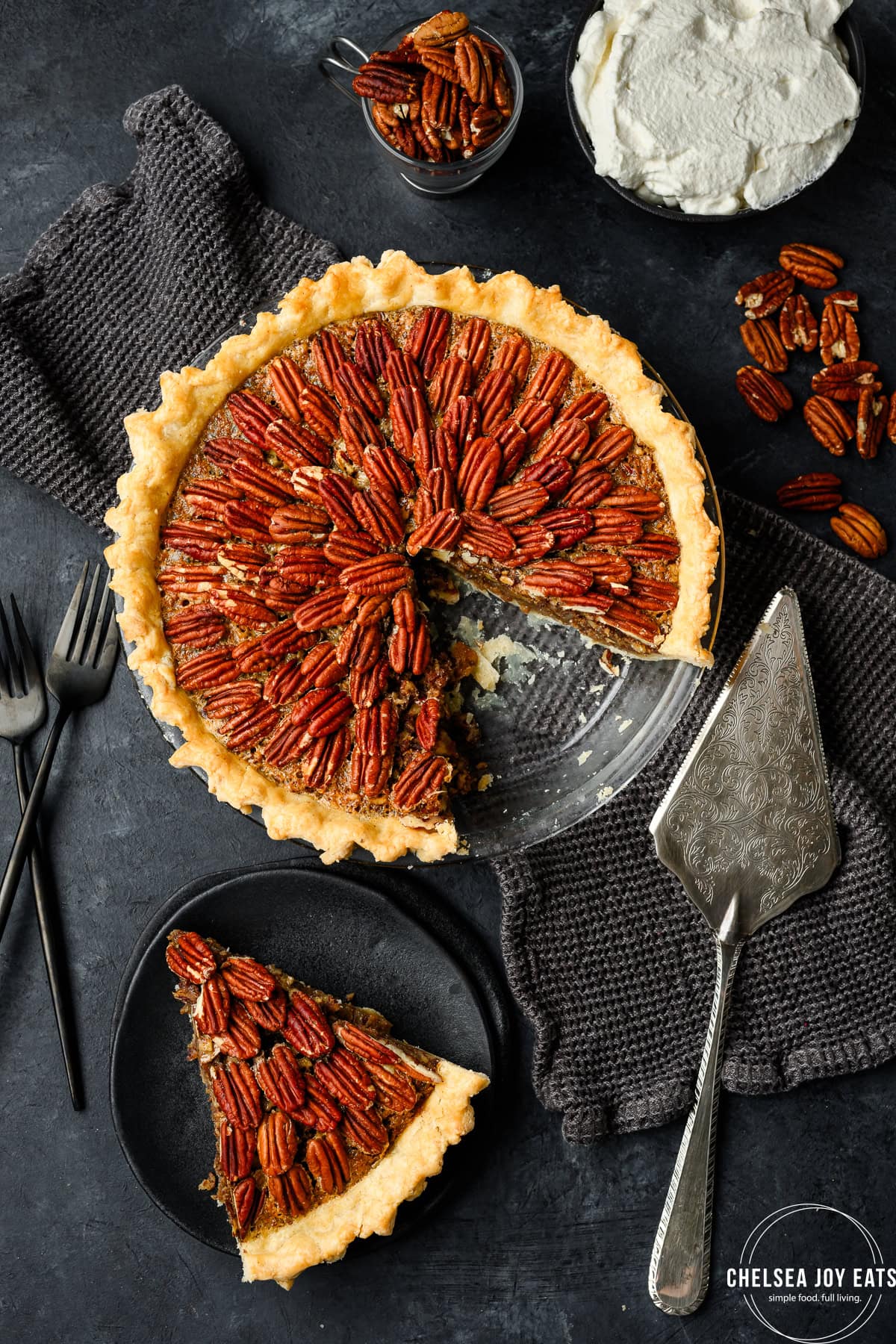 Overhead view of a pecan pie with a slice removed and on a plate