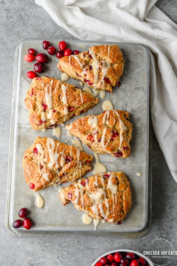 Overhead view of cranberry orange scones on a metal tray