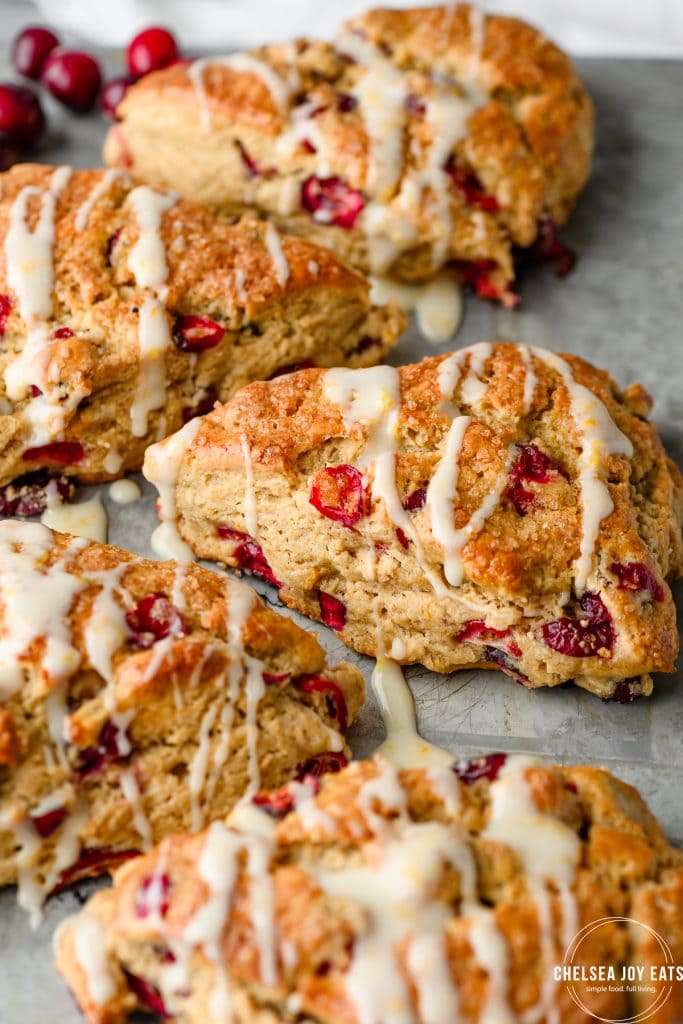 Closeup of a gluten free cranberry orange scone on a metal tray