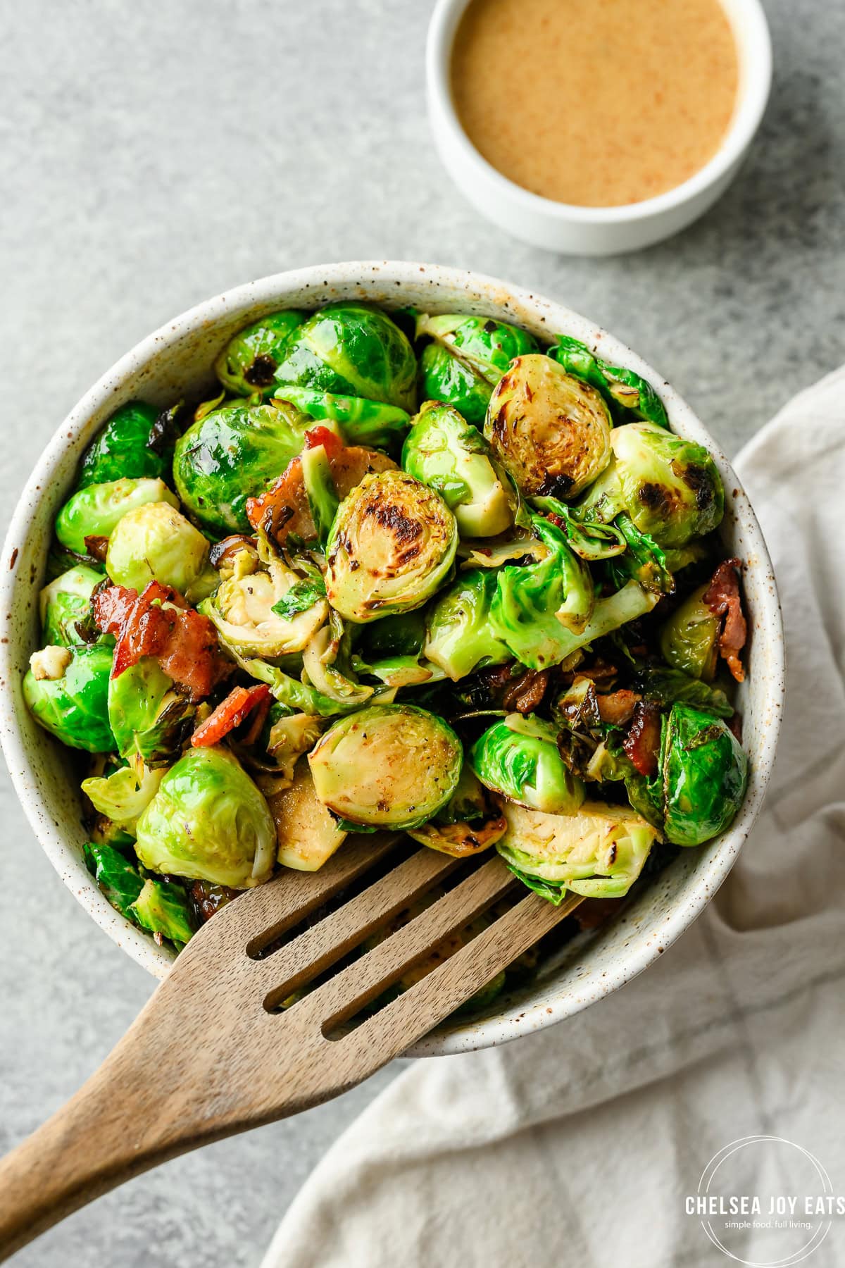 Overhead view of a bowl of Brussels Sprouts with Bacon Honey Mustard Sauce