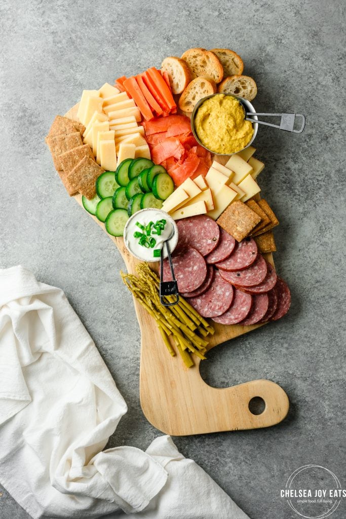 Scandinavian charcuterie board with salami, cheddar, and veggies