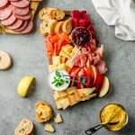 Scandinavian-inspired charcuterie board with sourdough, cheese, lox, meats, and veggies