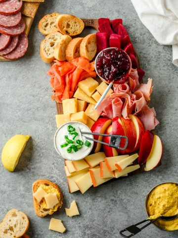 Scandinavian-inspired charcuterie board with sourdough, cheese, lox, meats, and veggies