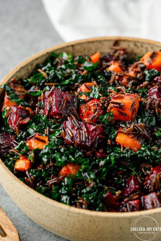 Closeup of butternut squash and beet salad with kale and wild rice