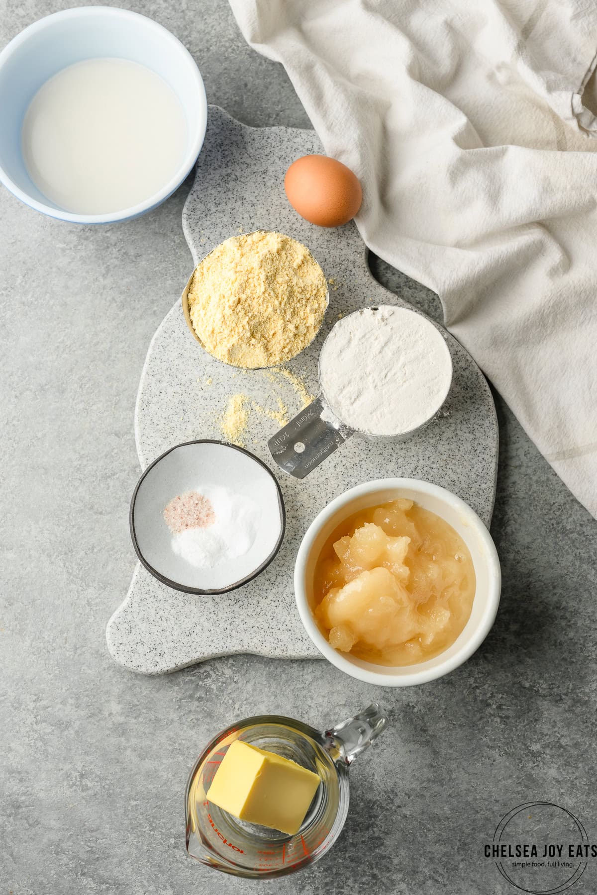 Ingredients for gluten free honey cornbread in small bowls and dishes