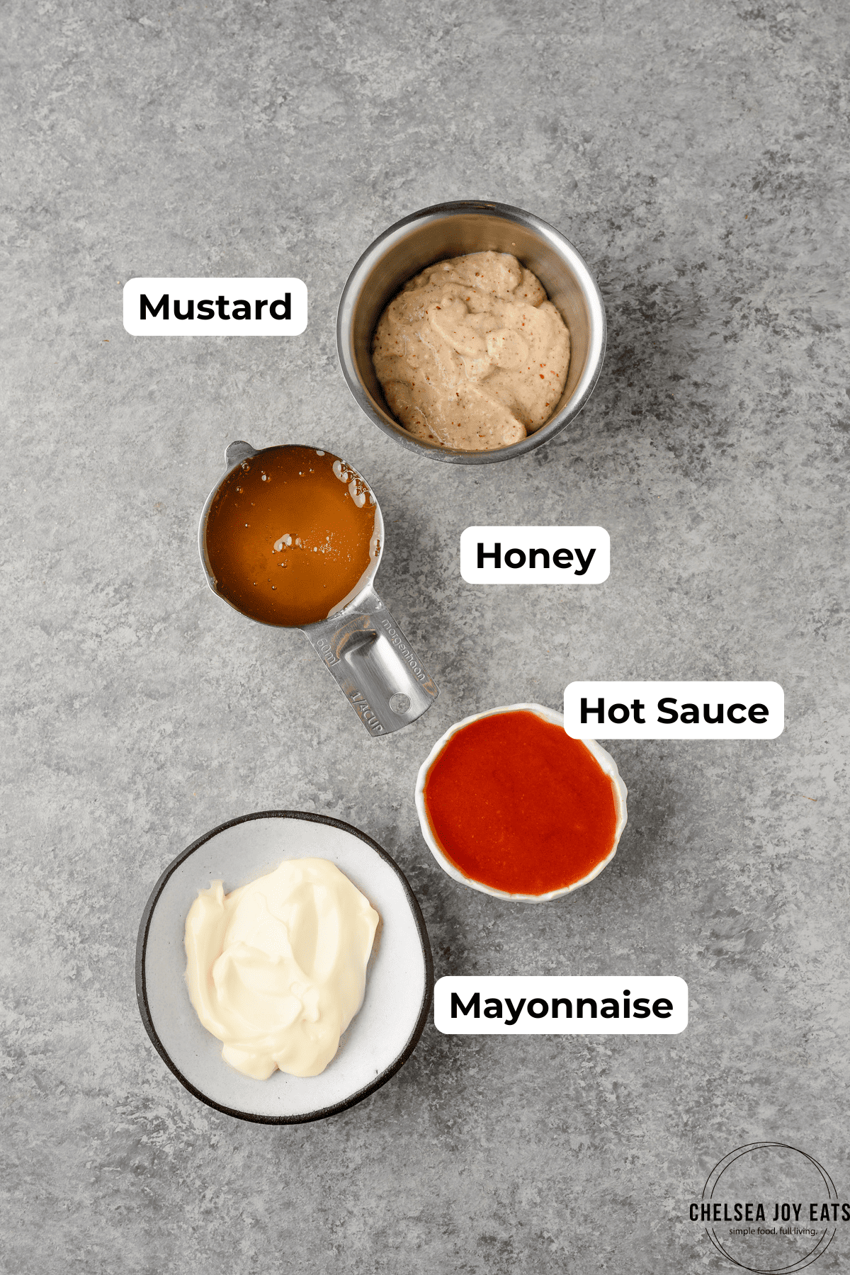 Ingredients for homemade hot honey mustard sauce with labels
