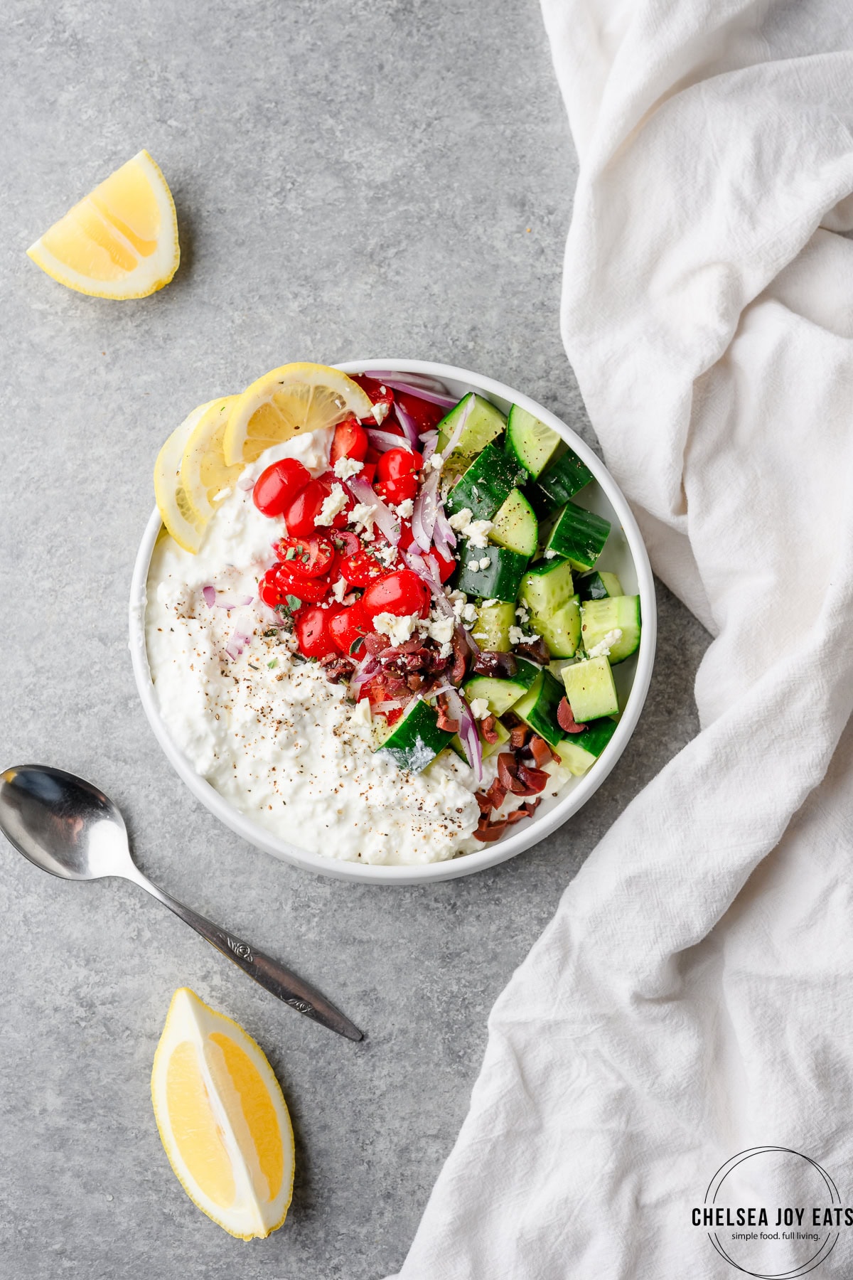 Savory cottage cheese bowl with cucumbers, tomatoes, red onion, and feta cheese