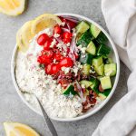 Savory cottage cheese bowl with cucumbers, tomatoes, red onion, and feta cheese
