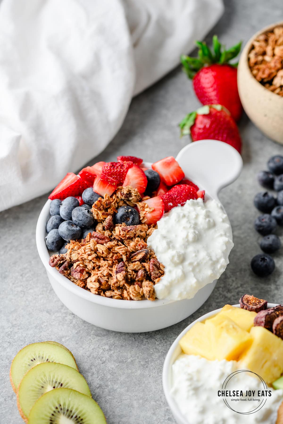 Cottage cheese bowl with granola, fresh strawberries, and blueberries