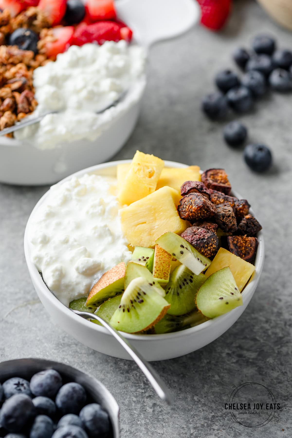 Cottage cheese bowl with kiwi, pineapple, and dried figs