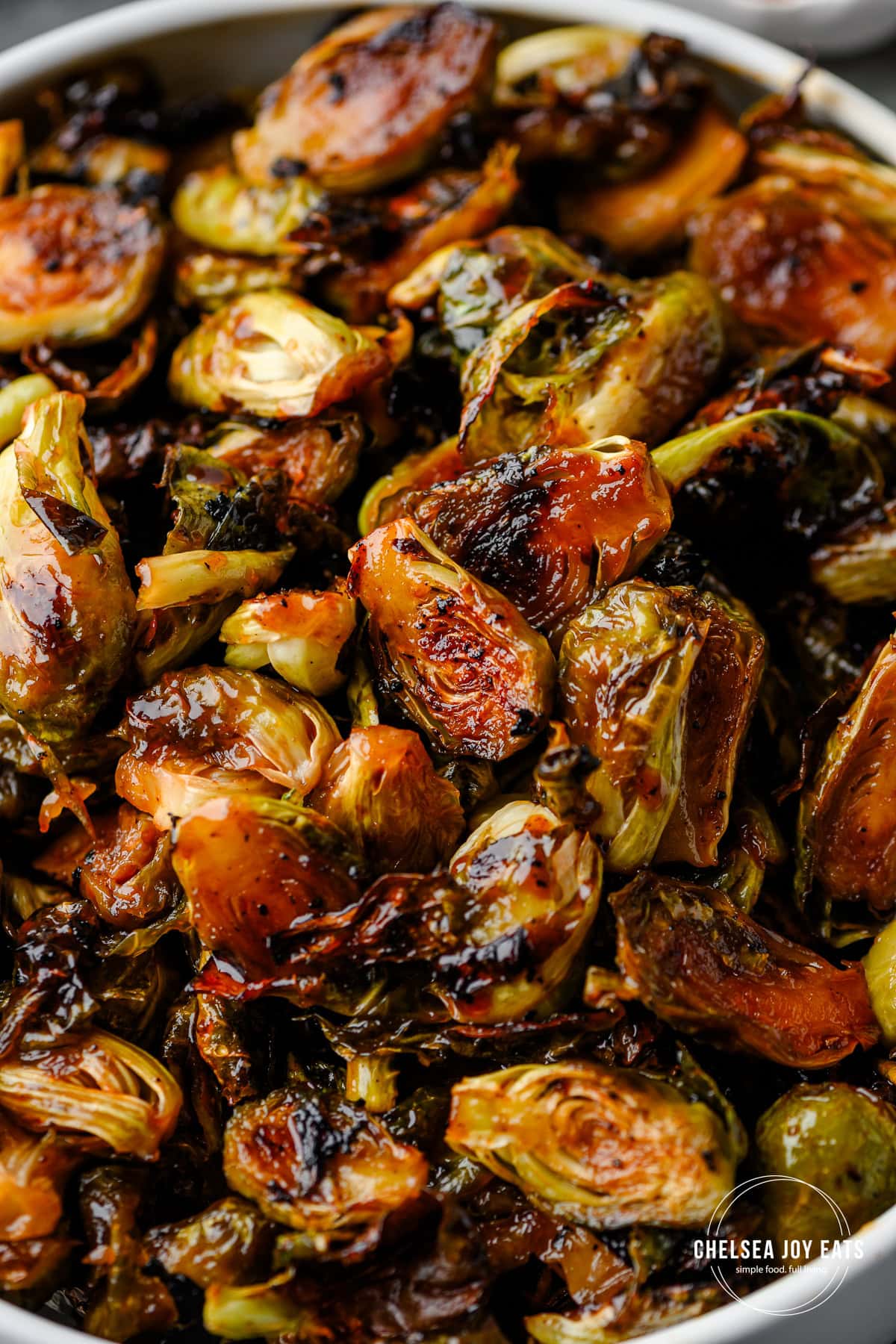 Closeup of roasted brussels sprouts glazed with hot honey sauce