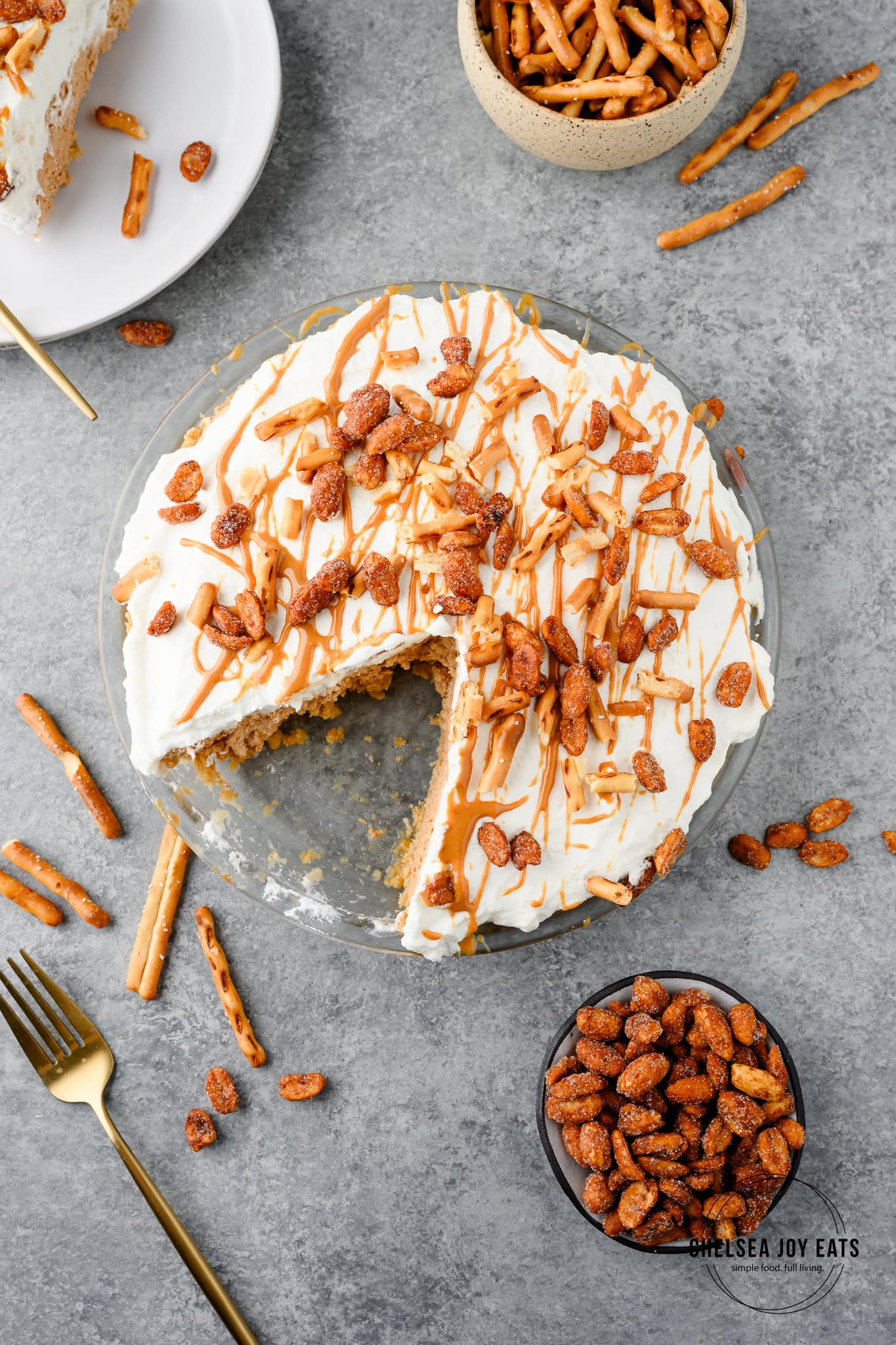 Overhead view of a no bake peanut butter pretzel pie with a slice taken out