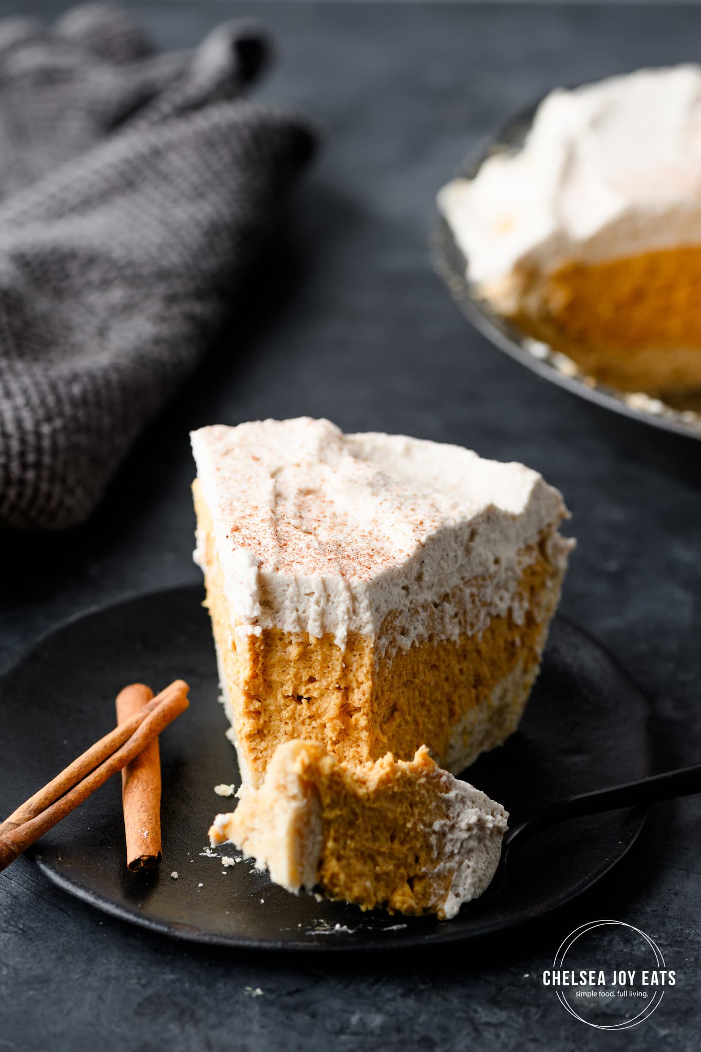 Closeup of a slice of gluten free no bake pumpkin chai pie with a forkful taken out