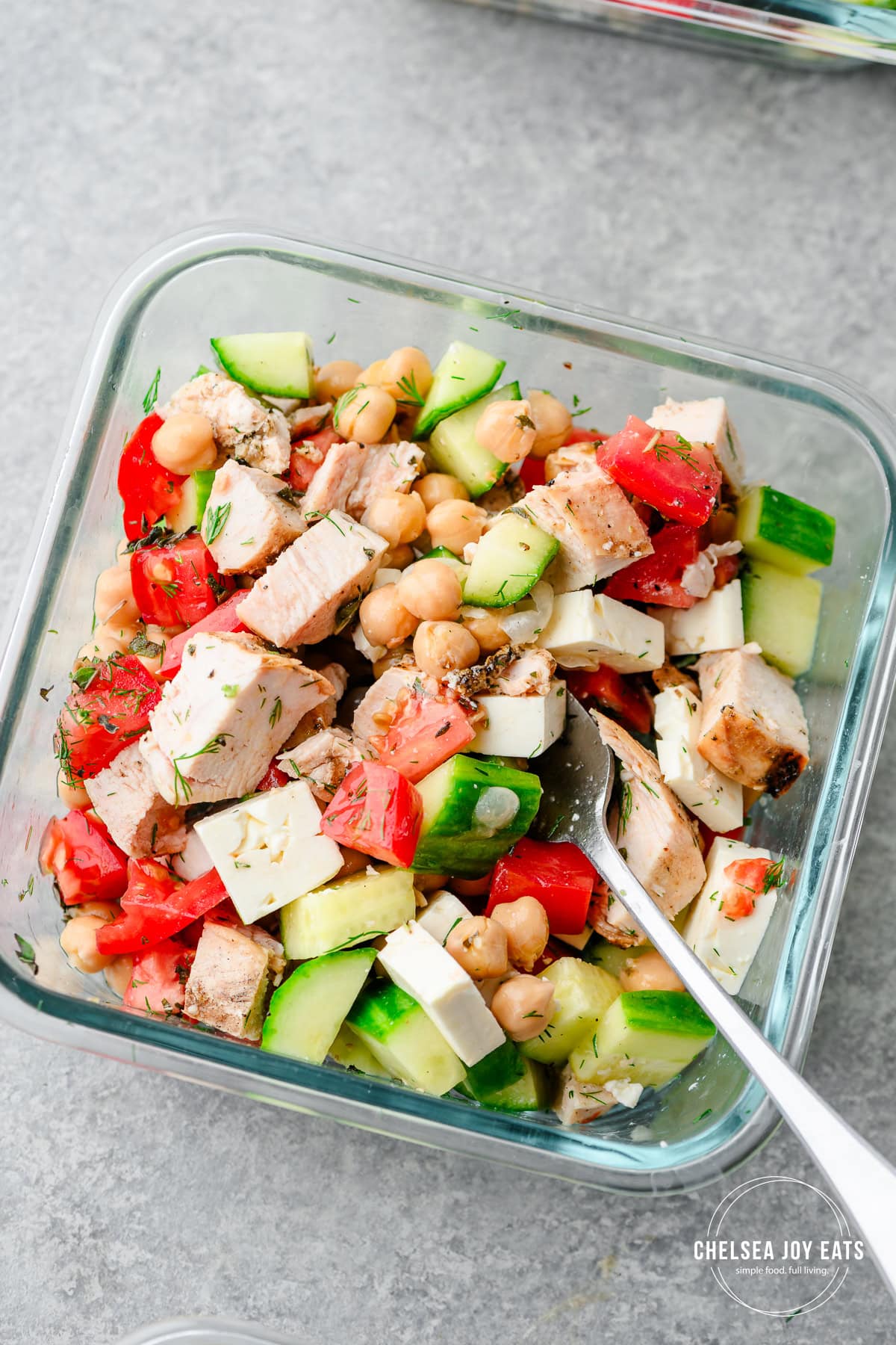 Closeup of a Greek salad bowl mixed up with a fork